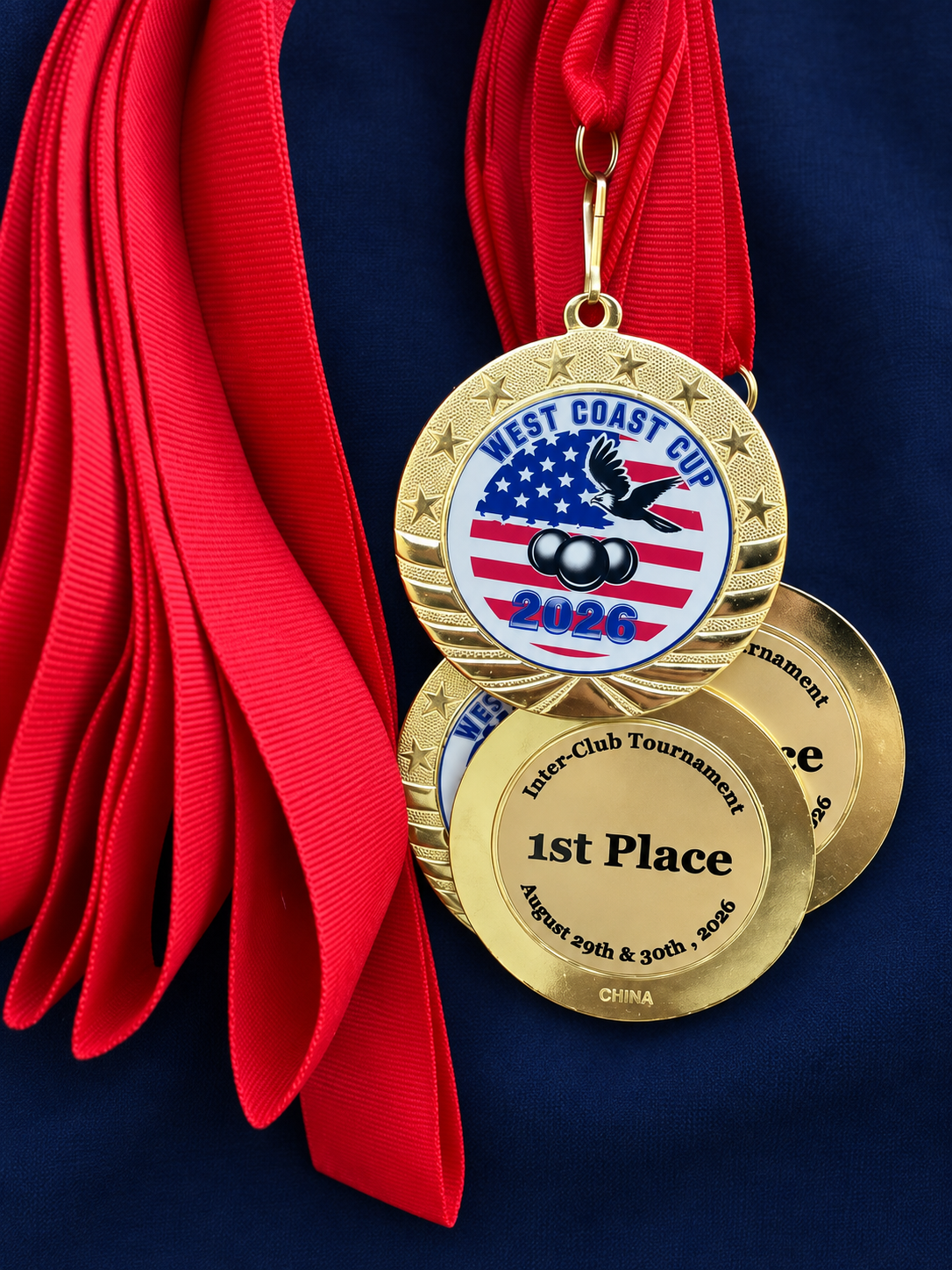 West Coast Cup 2026 first-place medals displayed on deep navy fabric